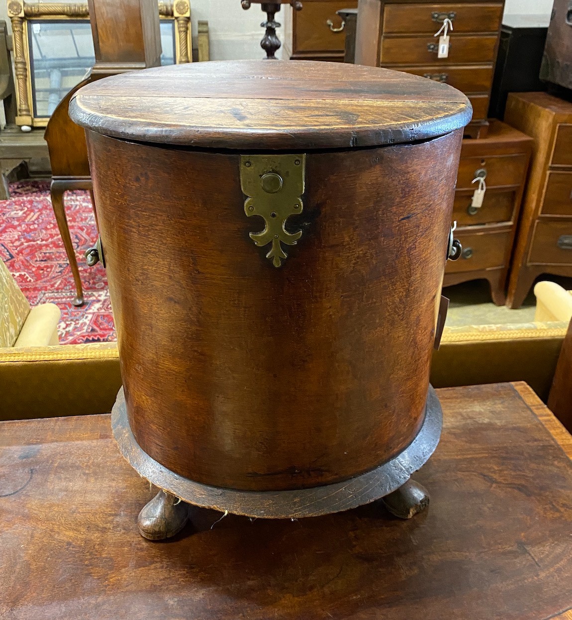 A George III style circular mahogany work box, diameter 38cm, height 47cm